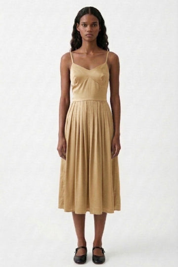 Mary Sand Dress by Doodlage, lightweight dress with a relaxed fit and subtle detailing, shown on a hanger.