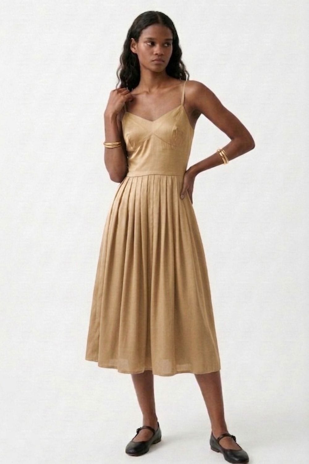 Mary Sand Dress by Doodlage, lightweight dress with a relaxed fit and subtle detailing, shown on a hanger.