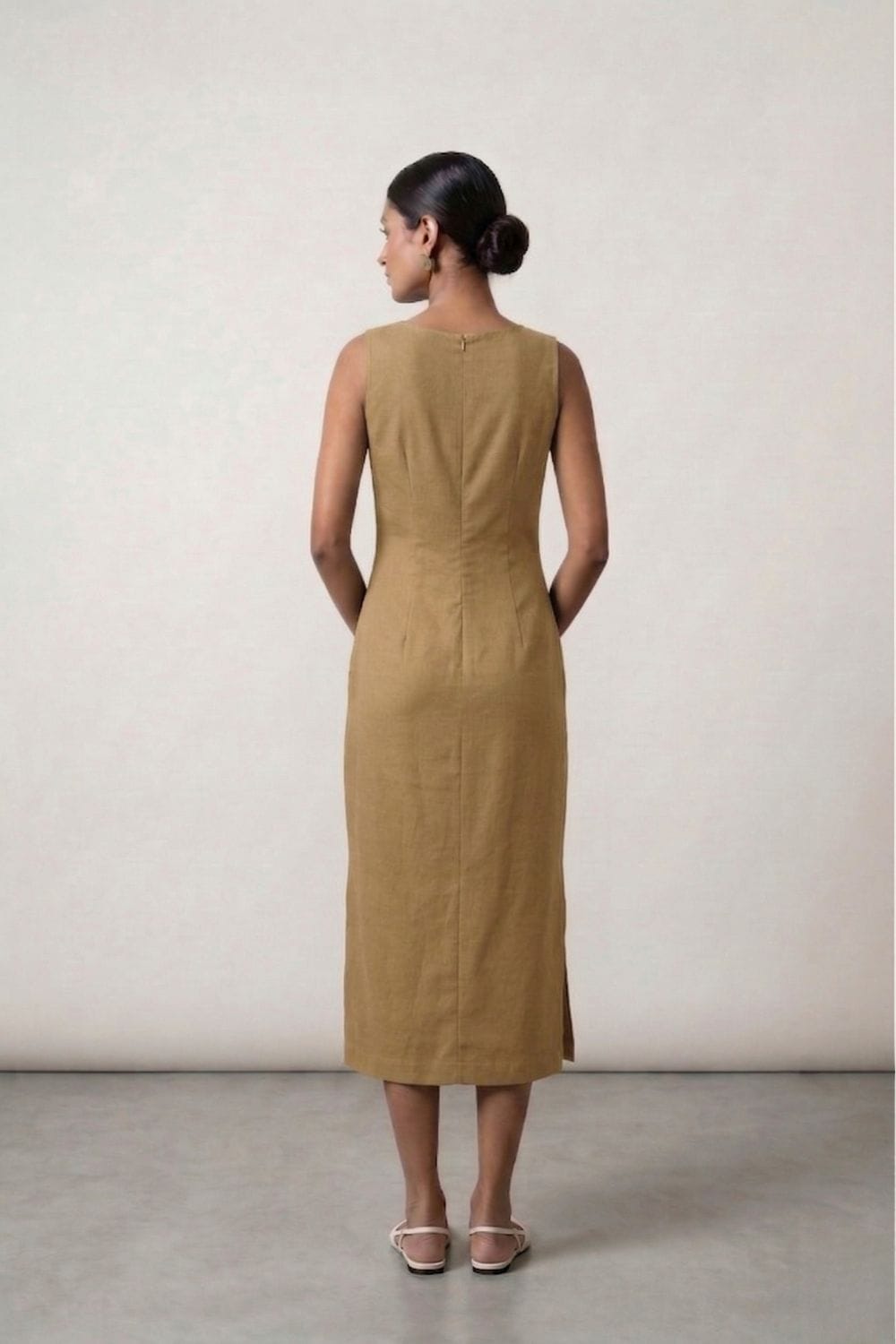 Sarah beige dress by Doodlage, featuring a flowy fabric and stylish design, displayed on a hanger against a neutral background.