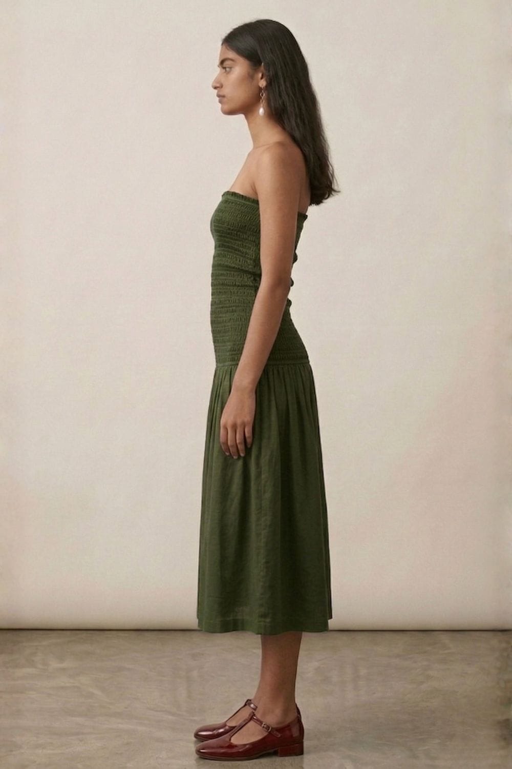 Green cherry print dress by Doodlage, showcasing a stylish and vibrant design with a fitted waist and flowy fabric.