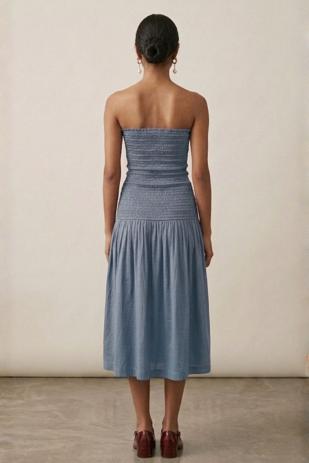 Cherry dusty blue dress by Doodlage, featuring a flowy fabric and elegant design, shown on a model.