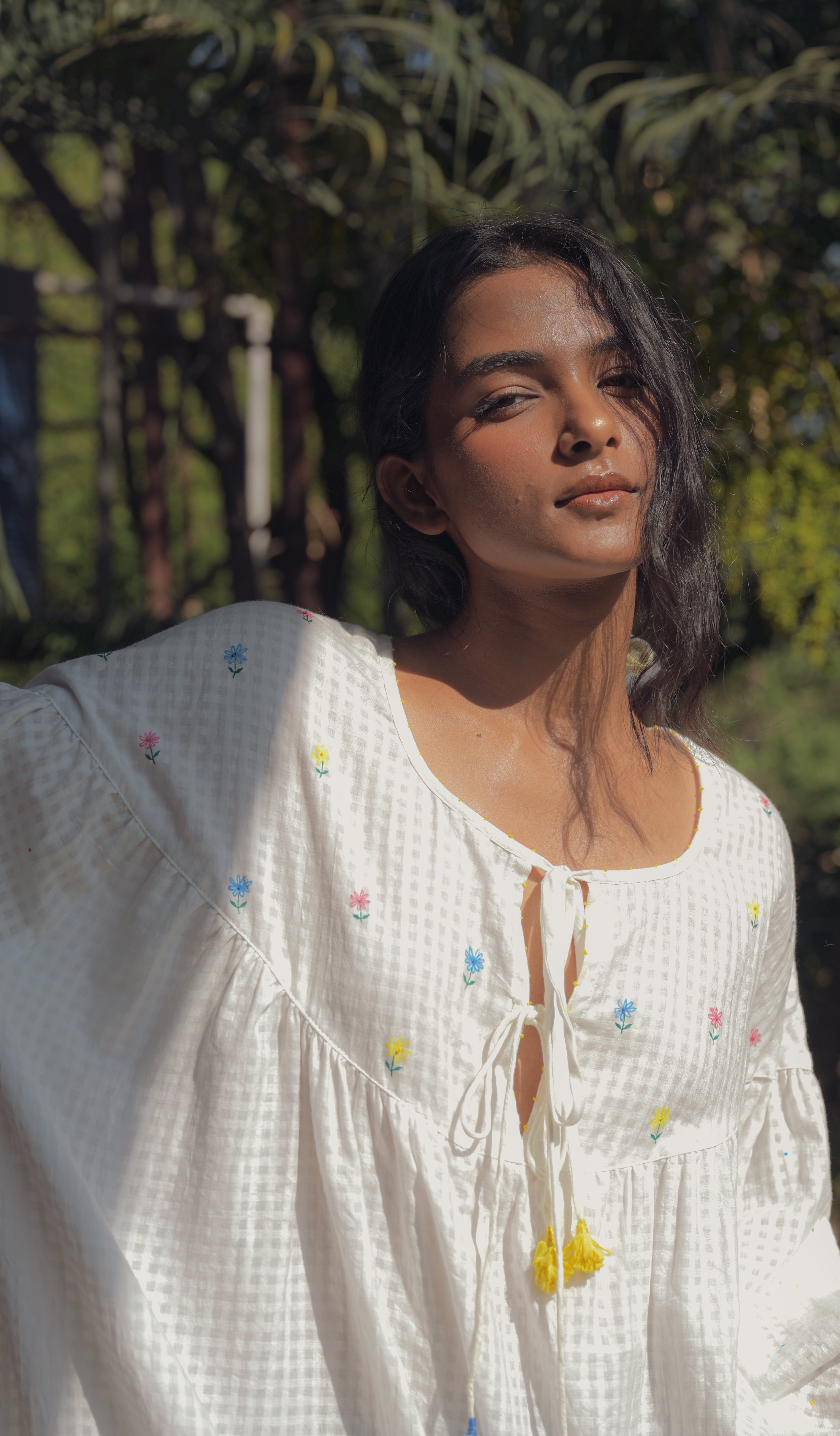 Deeta Flora oversized white dress with floral details, flowing fabric, and relaxed fit, perfect for casual or summer wear.