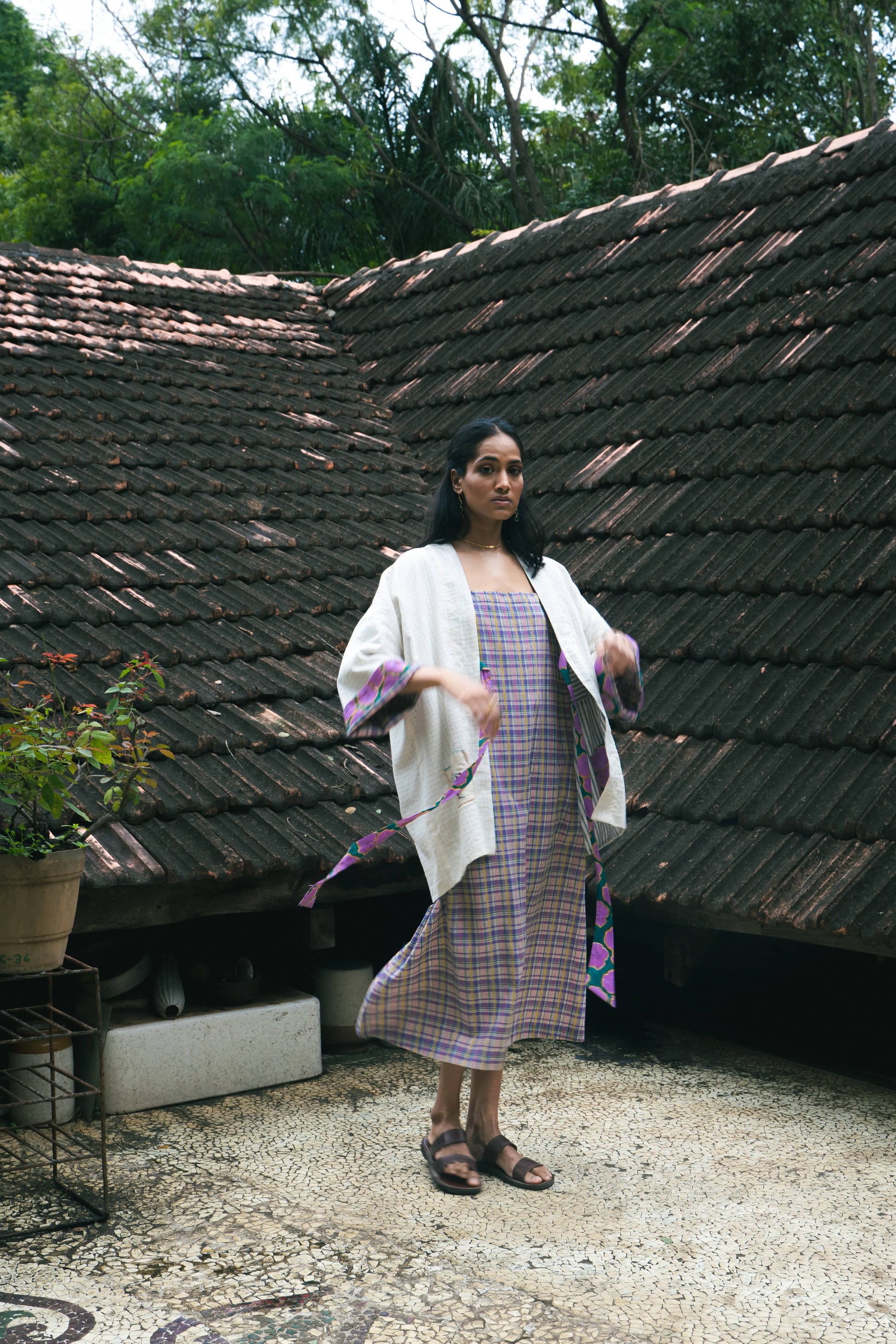 Deeta Meadow dress shown on a hanger with floral pattern and flowing fabric, perfect for casual or summer wear.