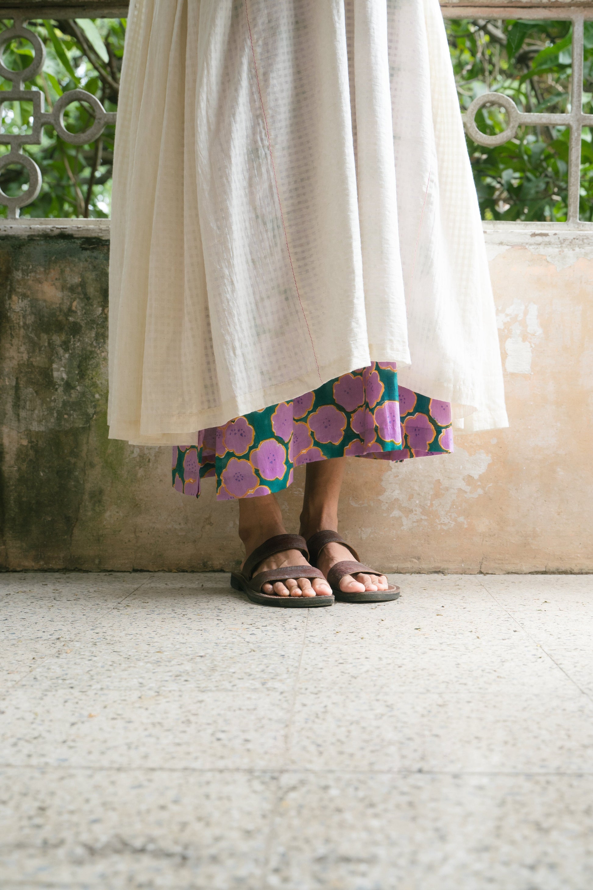 Deeta Noor dress featuring a flowing fabric and elegant design, shown in a close-up view highlighting the dress's details.