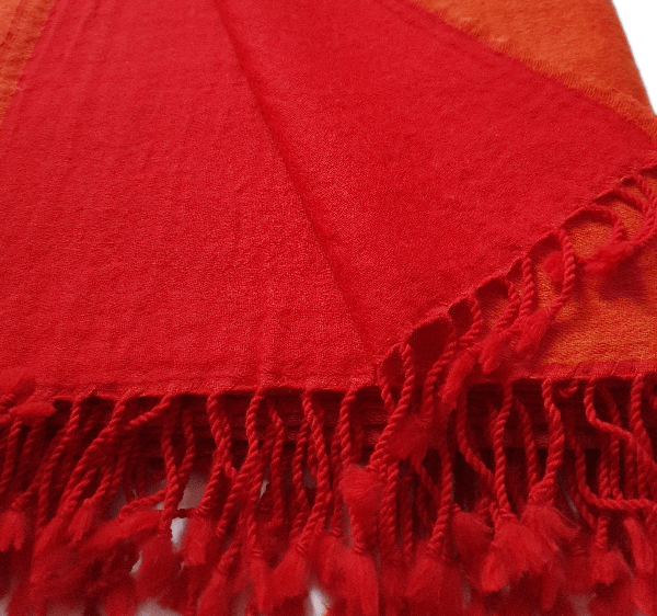 Bombaybirds flamed tangerine throw blanket with fiery orange and red patterns, perfect for cozy living room decor.