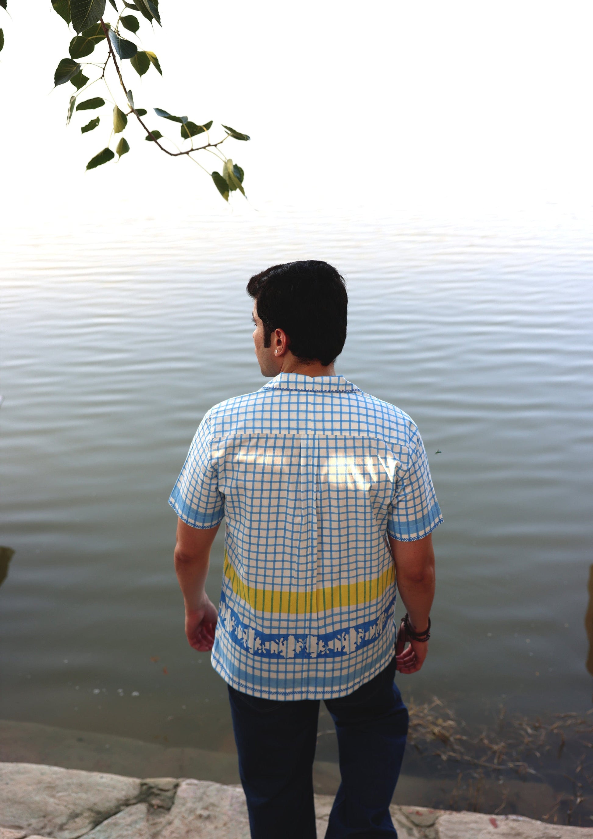 Blue checkered half sleeve shirt from The Raw India, featuring a casual fit and classic style perfect for everyday wear.