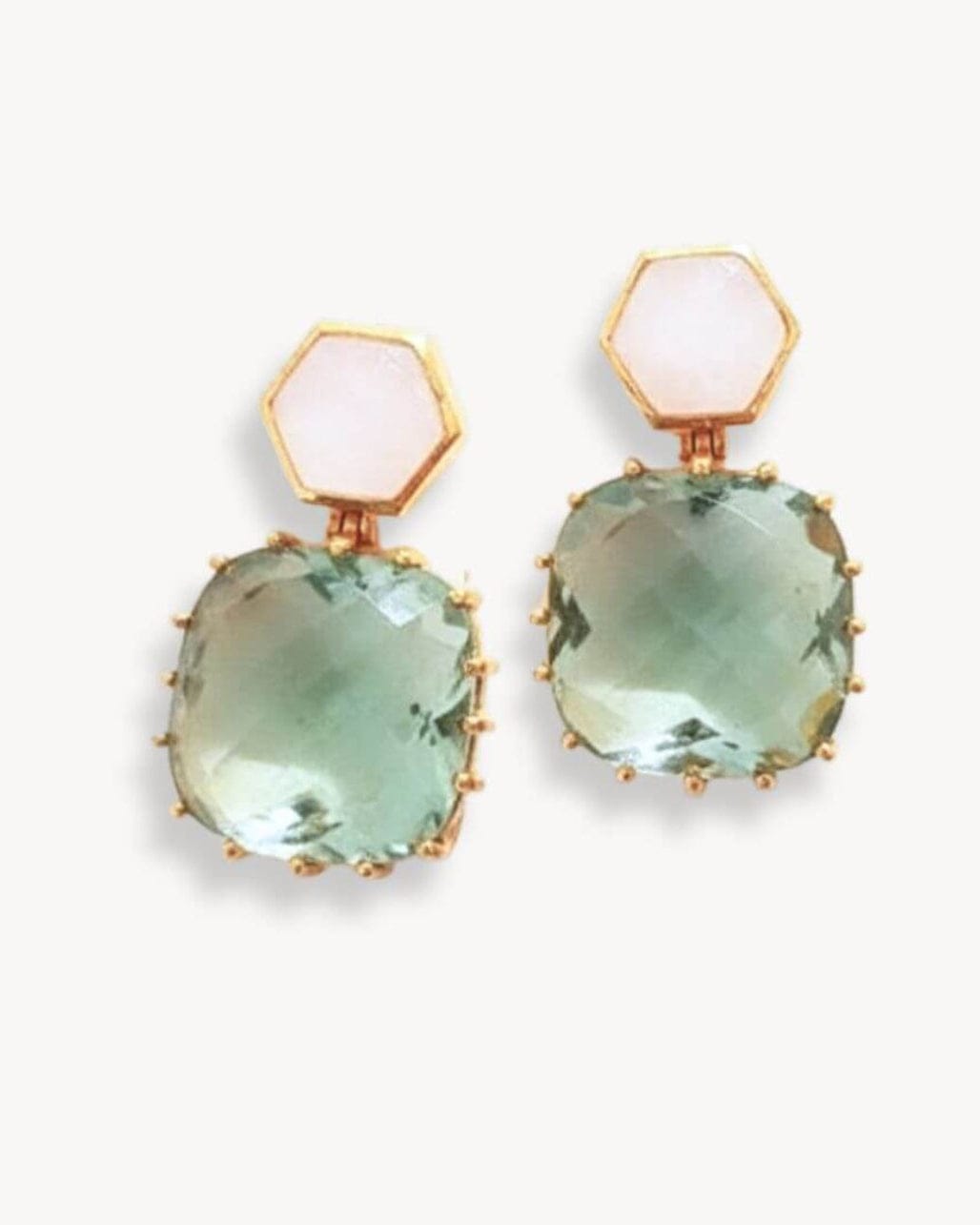 Gold earrings from Bombaybirds Ila Amy collection featuring elegant, shiny design with intricate detailing and a classic hoop style.