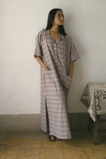Deeta Meadow long tunic dress featuring a flowy silhouette, floral print, and lightweight fabric on model.
