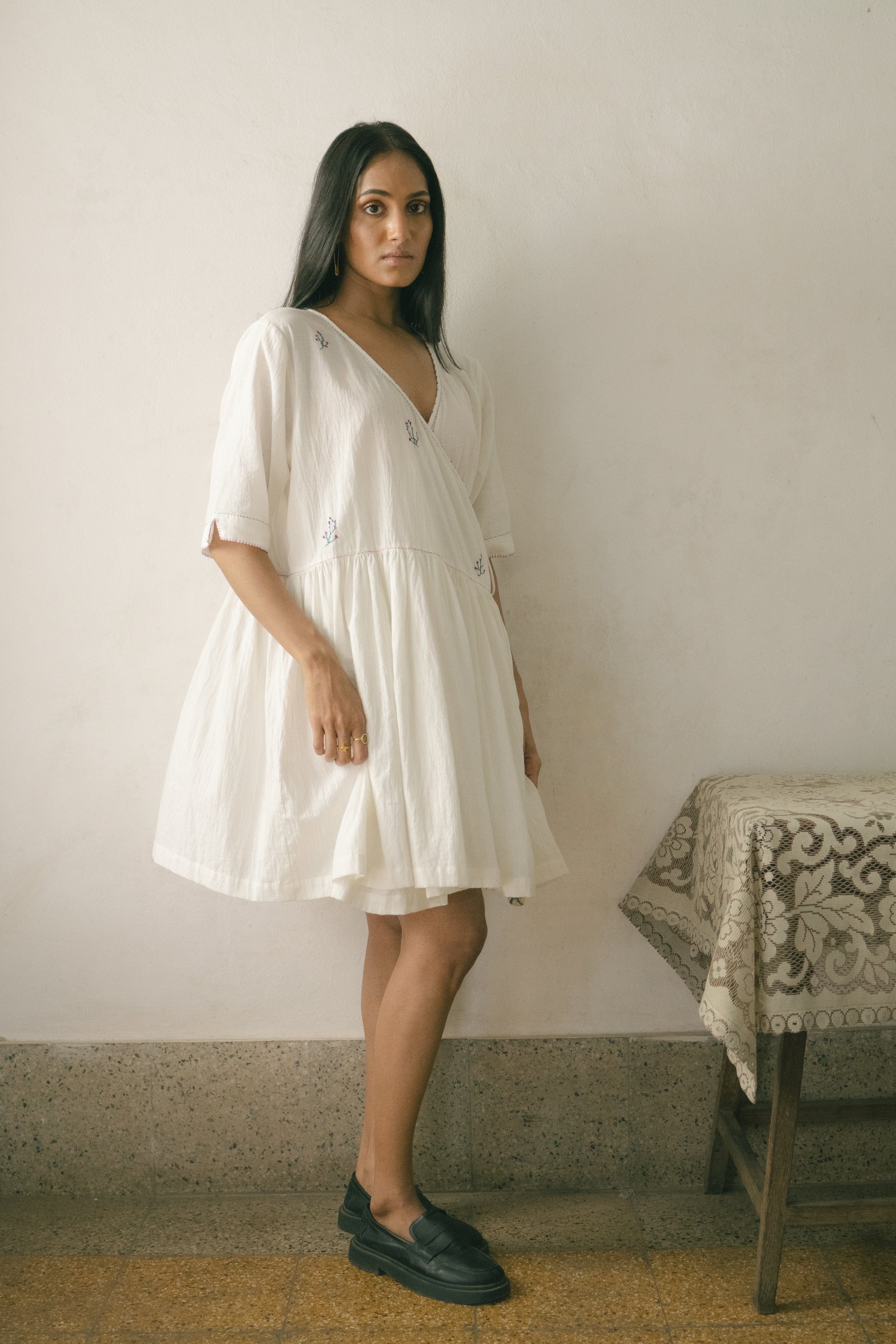 Deeta Sara tunic dress with long sleeves and a relaxed fit, shown in a soft, flowy fabric in the image.