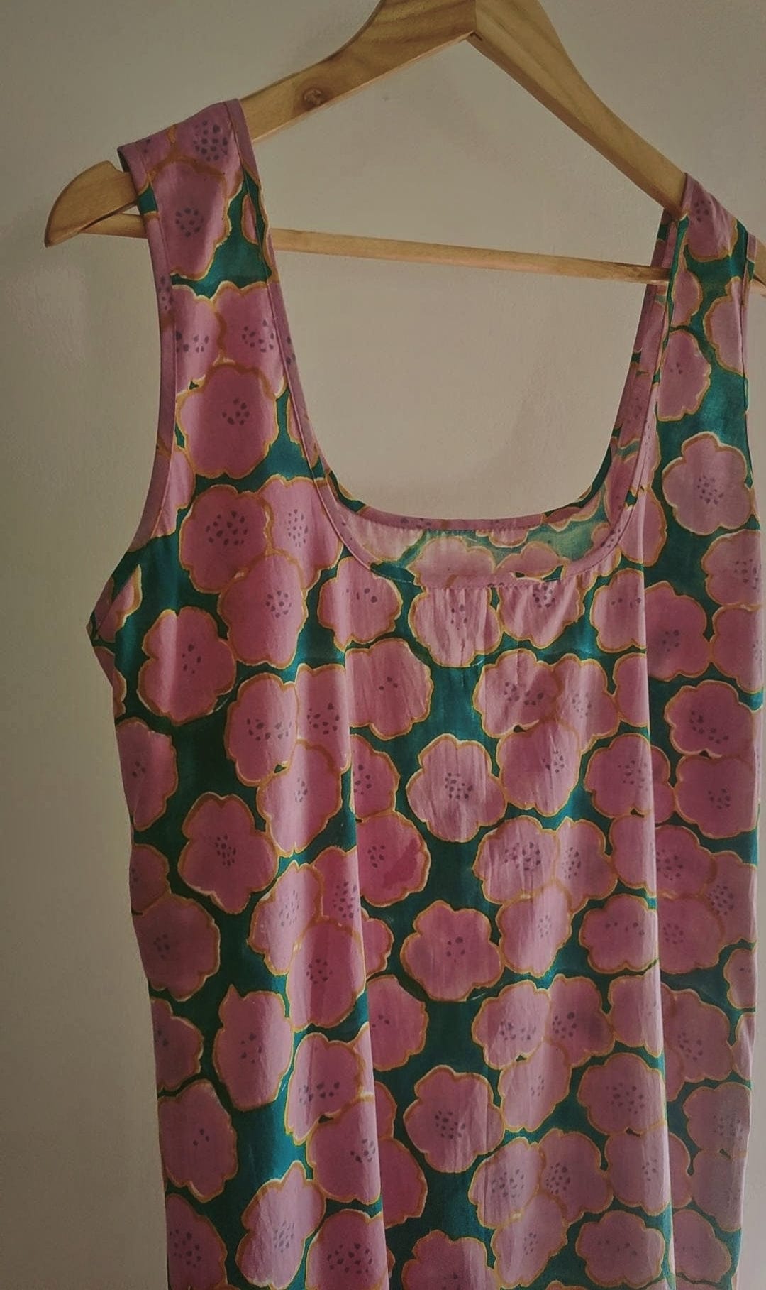 Deeta Clover slip dress featuring a soft, flowing fabric with a floral pattern, sleeveless design, and a relaxed fit.