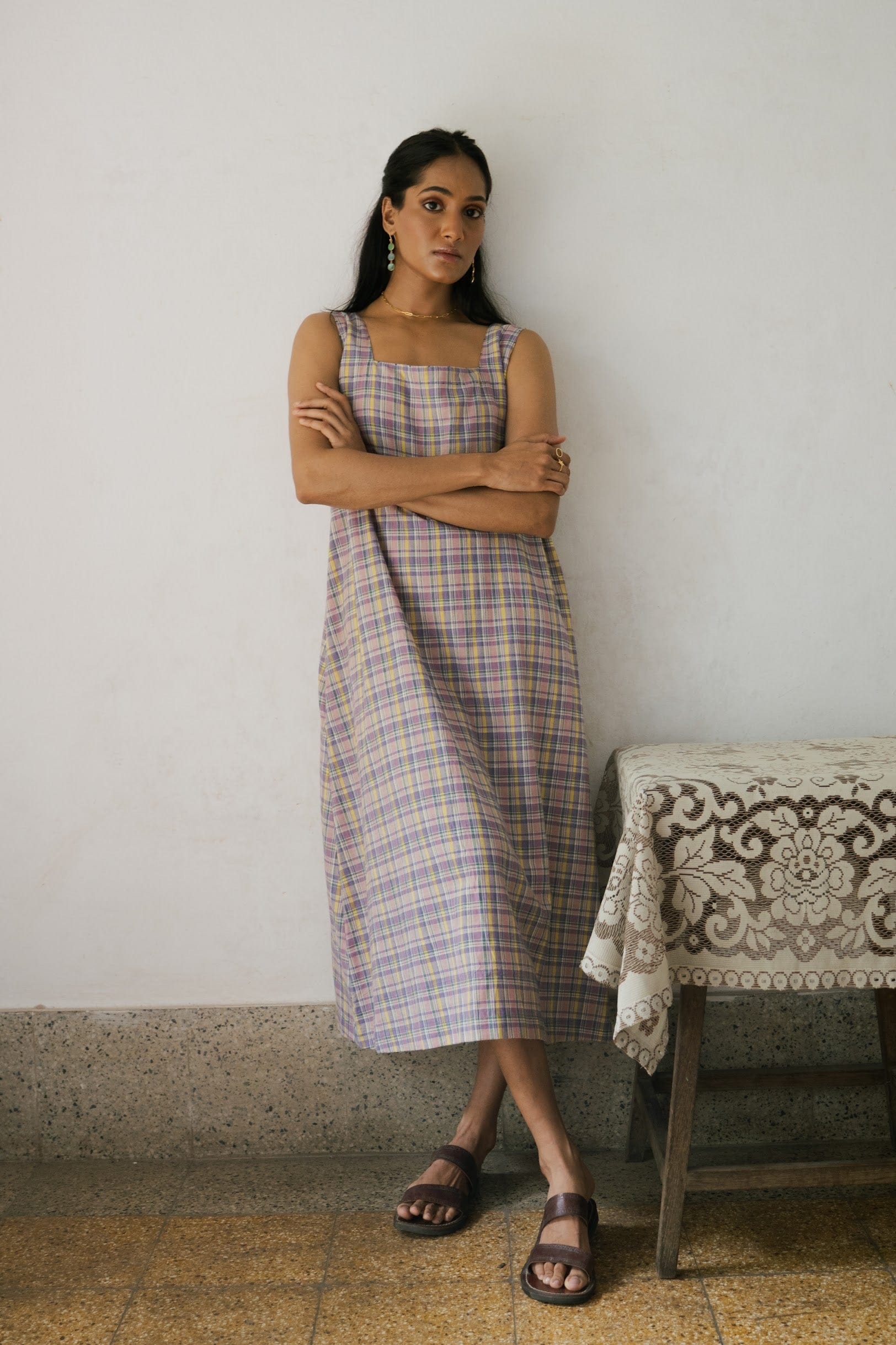 Deeta Meadow dress displayed on a hanger, featuring a flowy, floral design perfect for casual or outdoor wear.