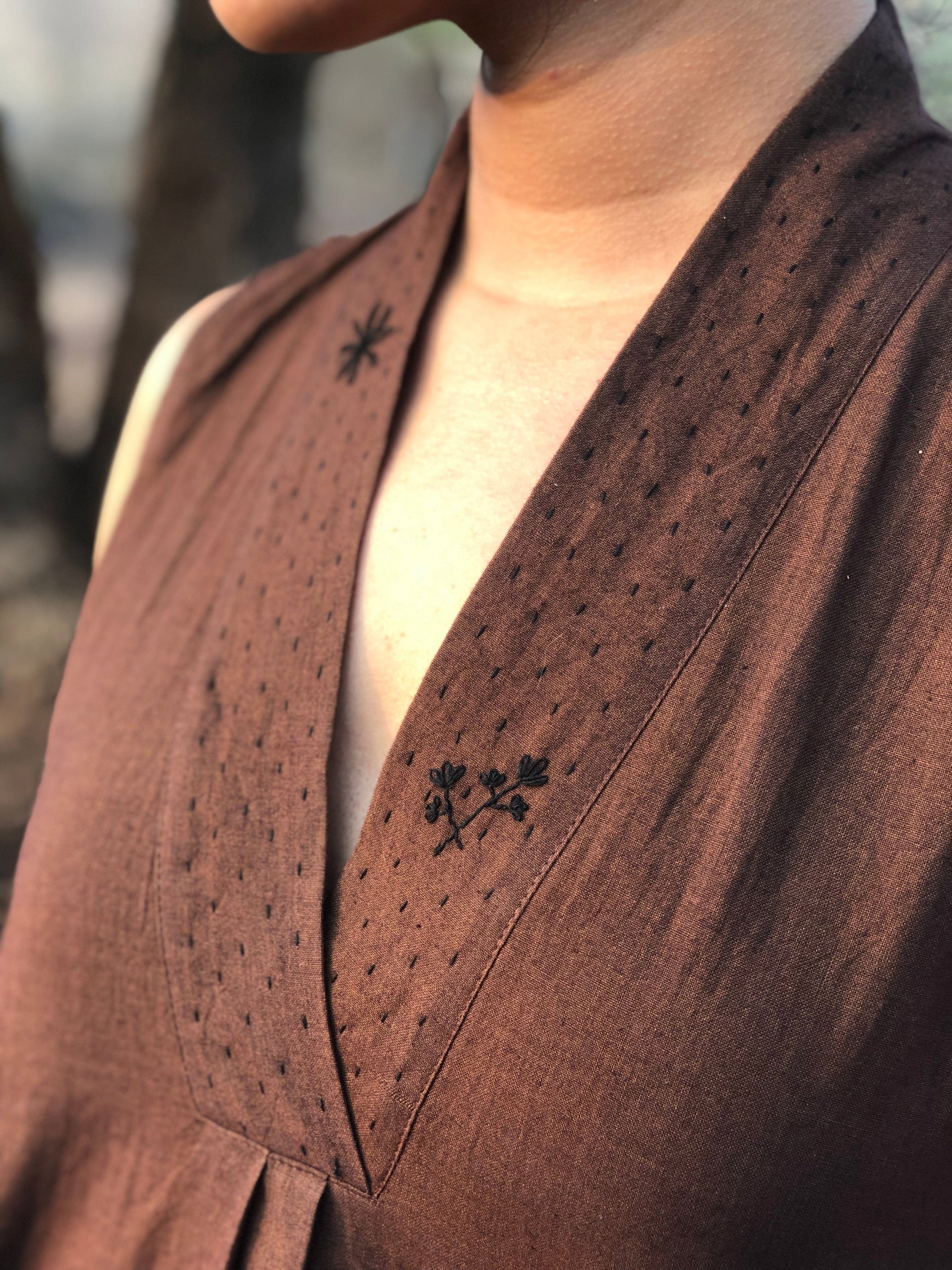Deeta Coco dress, stylish summer dress with floral pattern, lightweight fabric, and off-shoulder design, perfect for casual occasions.