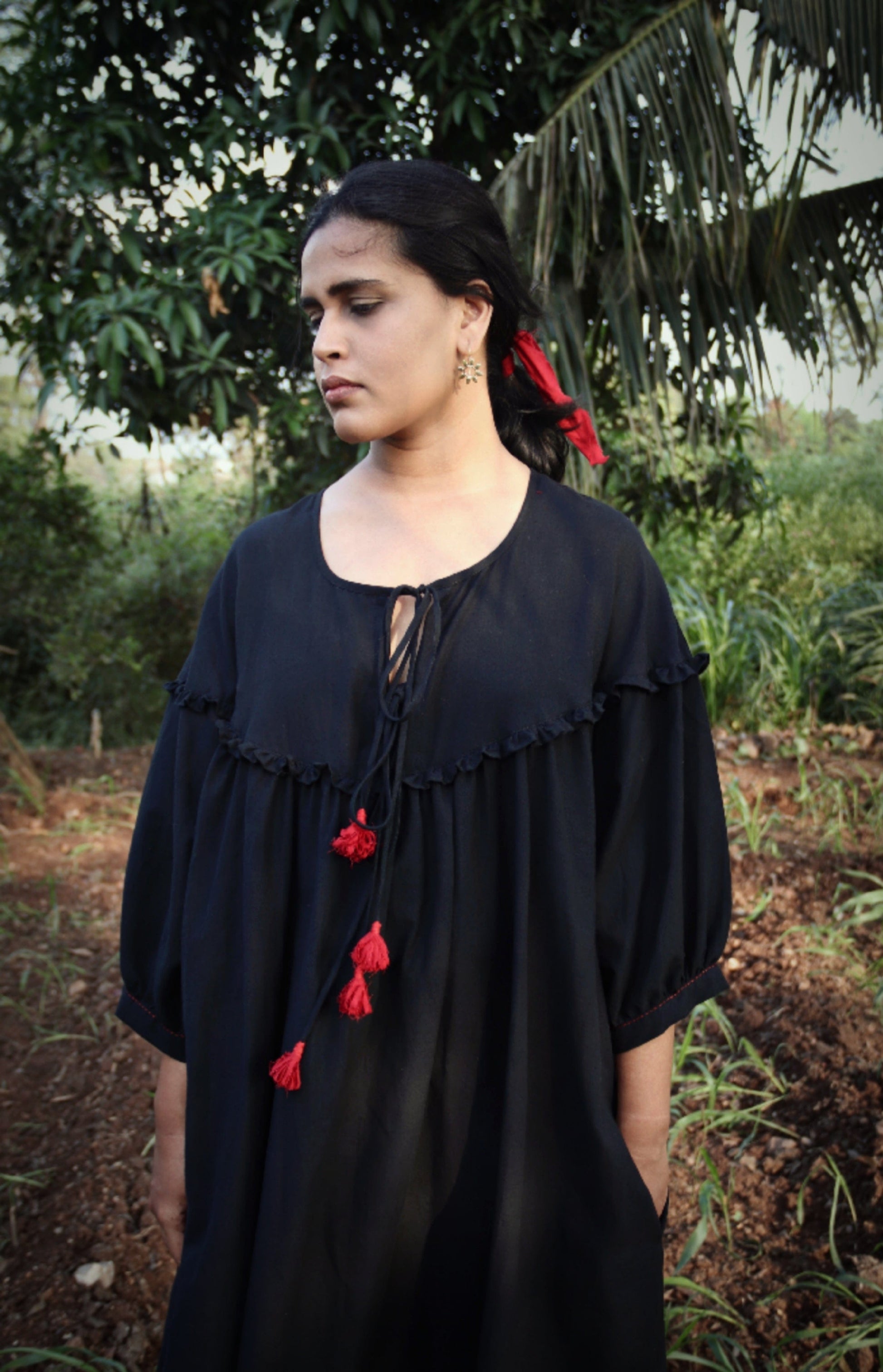 Black Raven Dress by Deeta featuring a stylish, elegant dress with detailed design and fitted silhouette, perfect for special occasions.