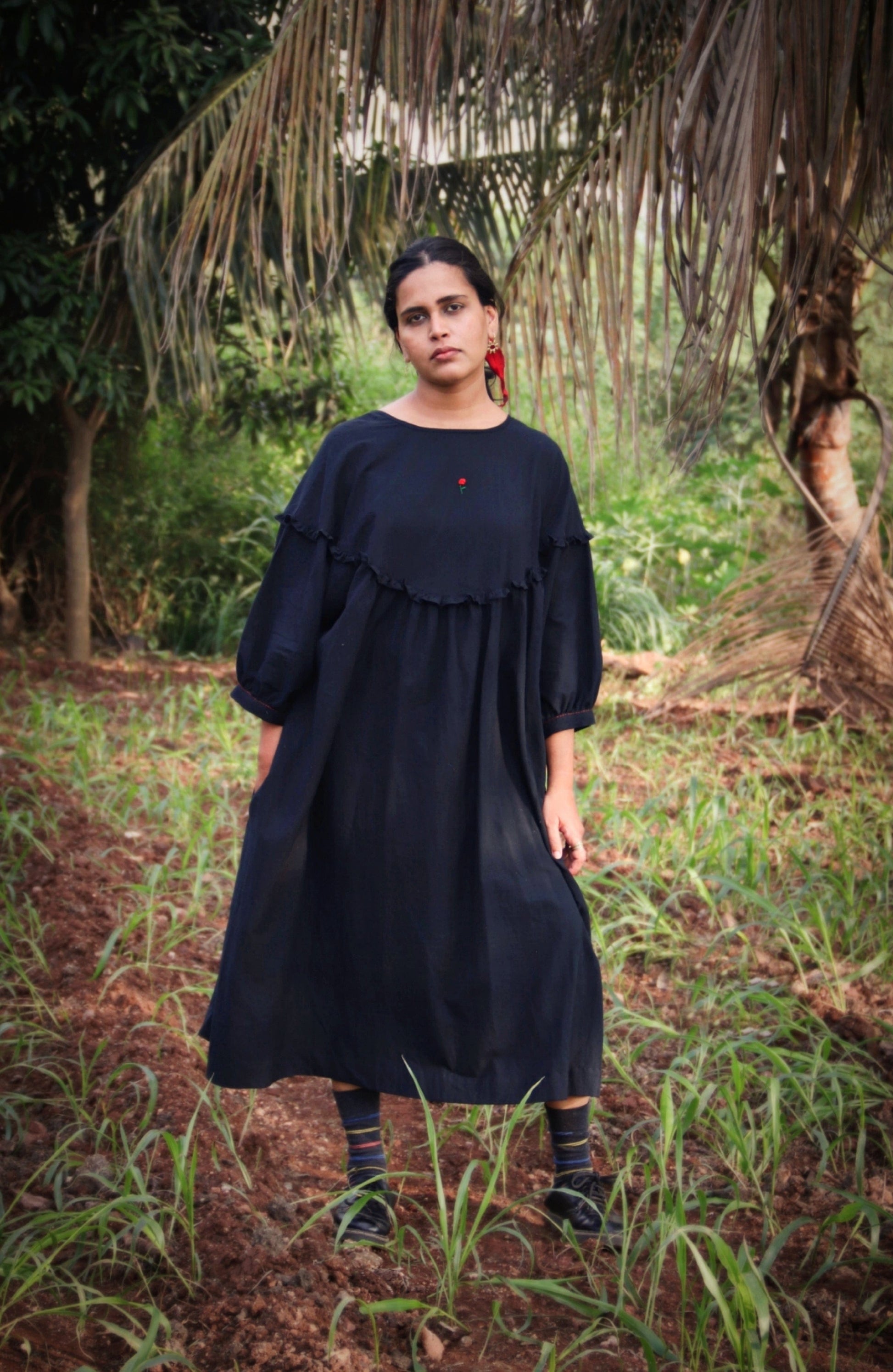 Black Raven Dress by Deeta featuring a sleek, elegant design with a fitted silhouette and stylish details.