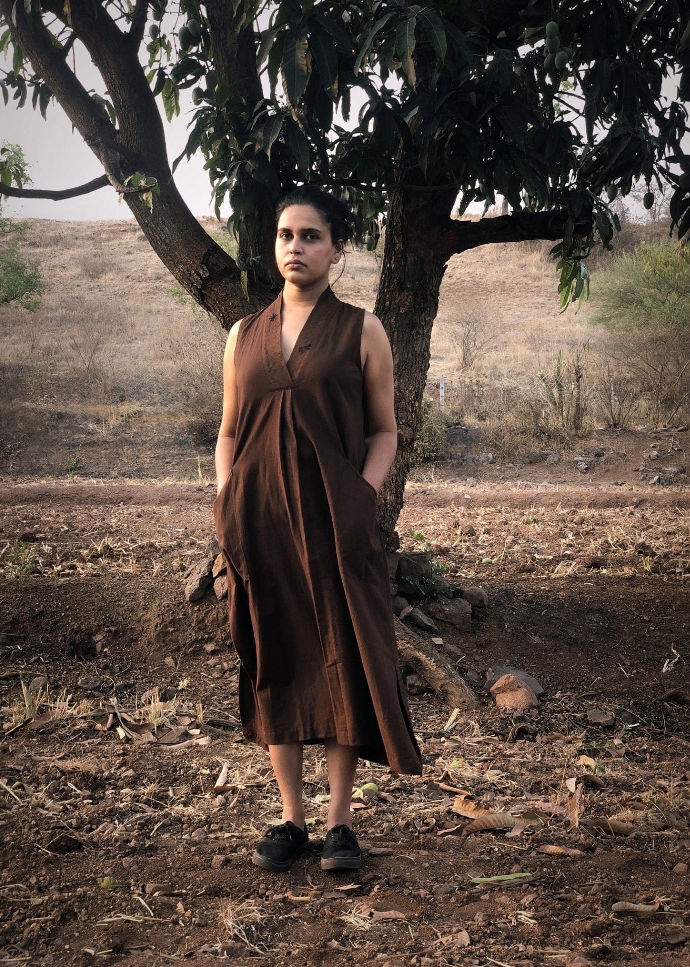 Deeta Coco dress featuring a stylish, flowy design with vibrant floral patterns, perfect for summer occasions.
