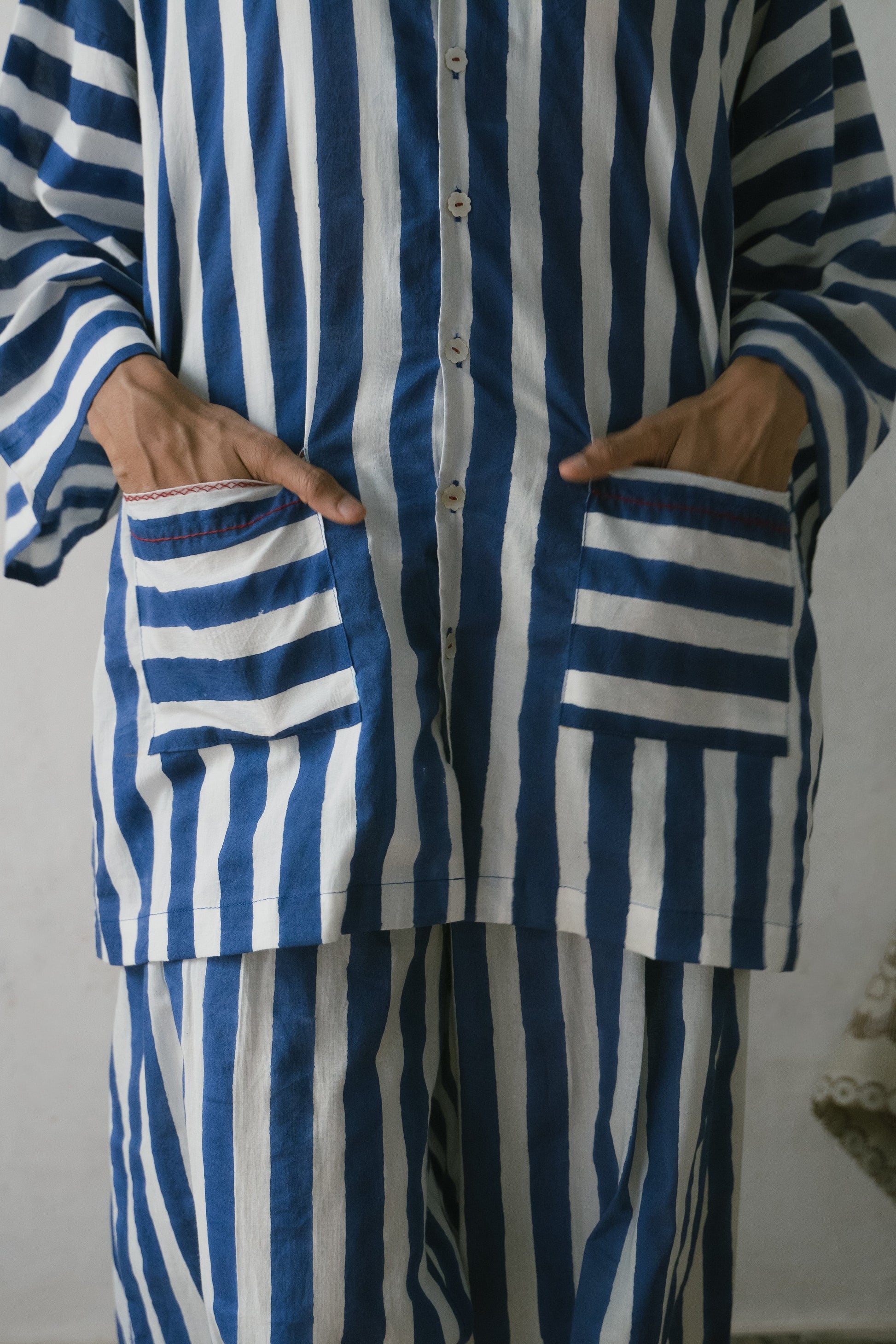 Deeta Shiro coord set featuring stylish shirts with a modern design, displayed on a mannequin with neutral background.