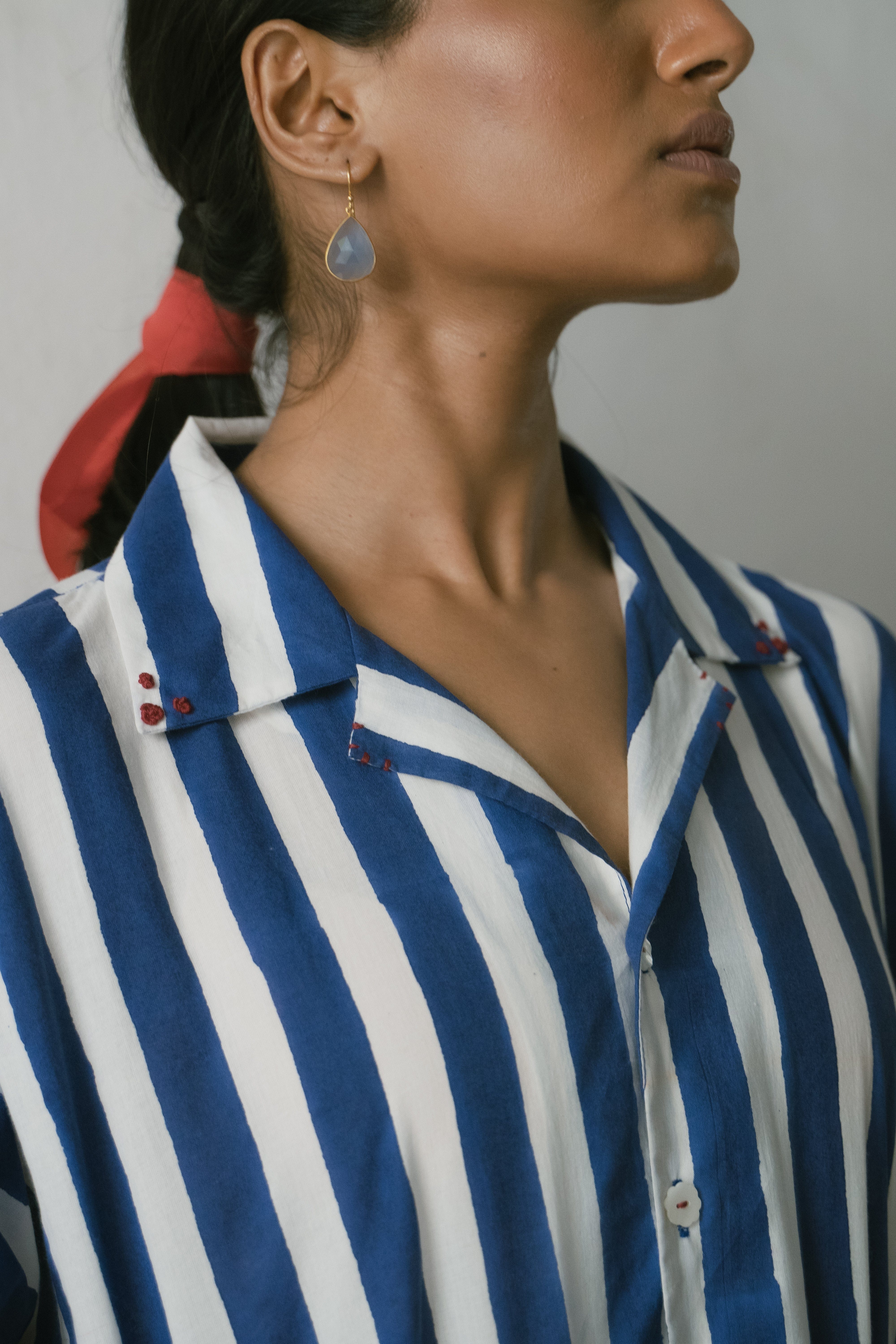 Deeta Shiro coord set shirts displayed on a hanger, featuring a stylish, casual design with button-up front and collar detail.