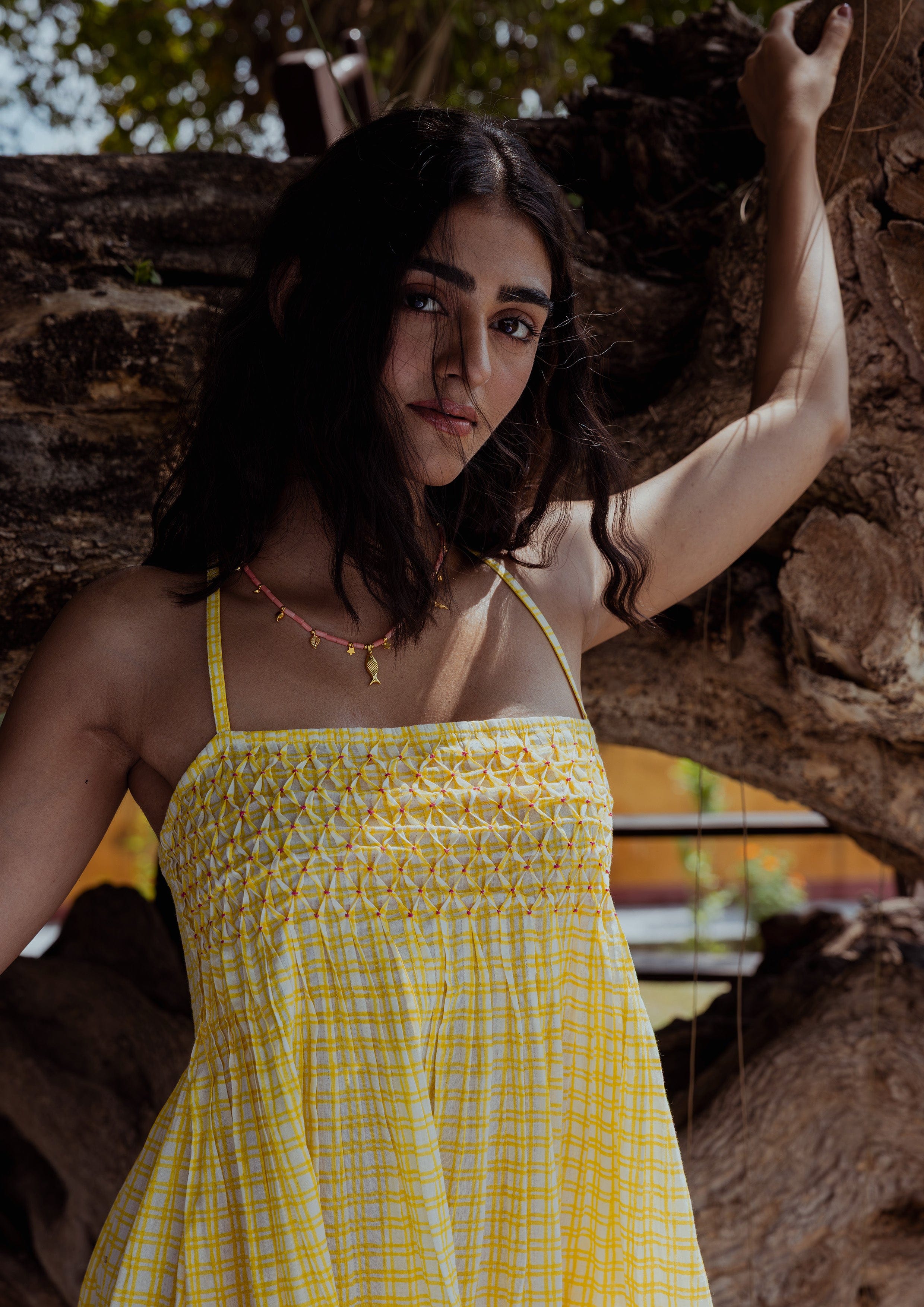 Elegant Jaali Dress by The Raw India featuring intricate checkered patterns and flowing fabric, perfect for stylish occasions.