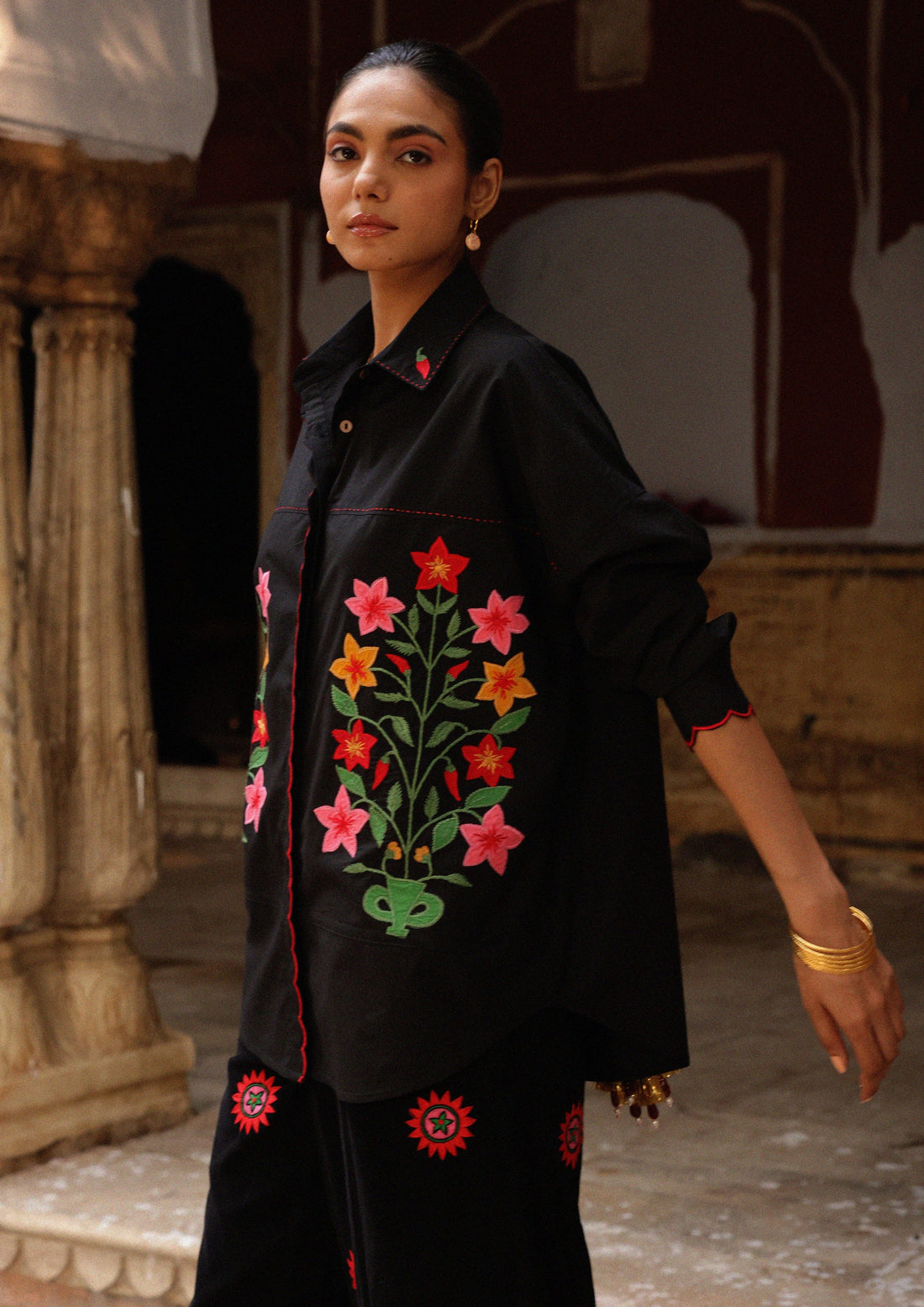 The Raw India Jaigarh shirt with aster buta patchwork embroidery, showcasing intricate design and vibrant fabric details.