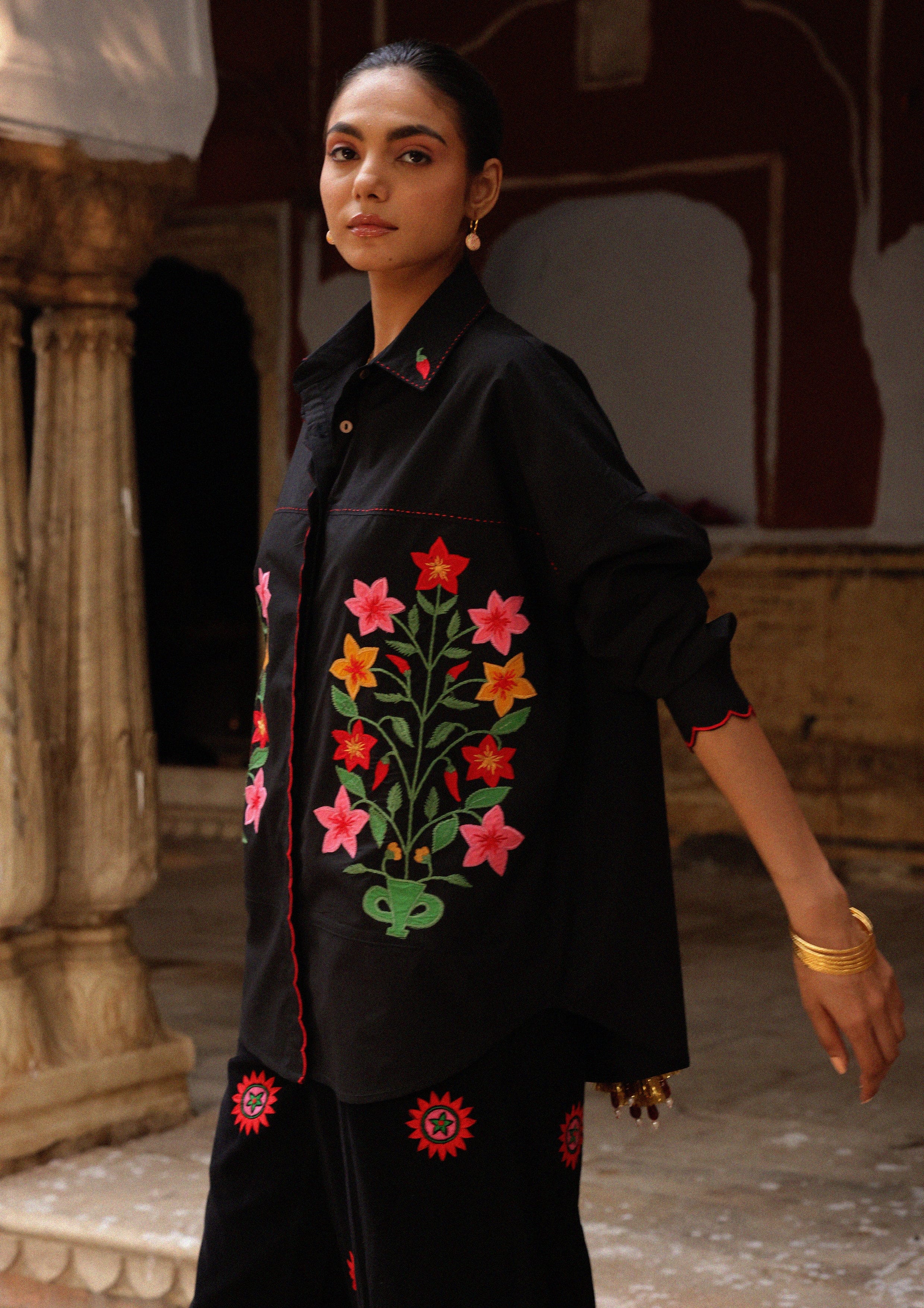 The Raw India Jaigarh shirt with aster buta patchwork embroidery, showcasing intricate design and vibrant fabric details.