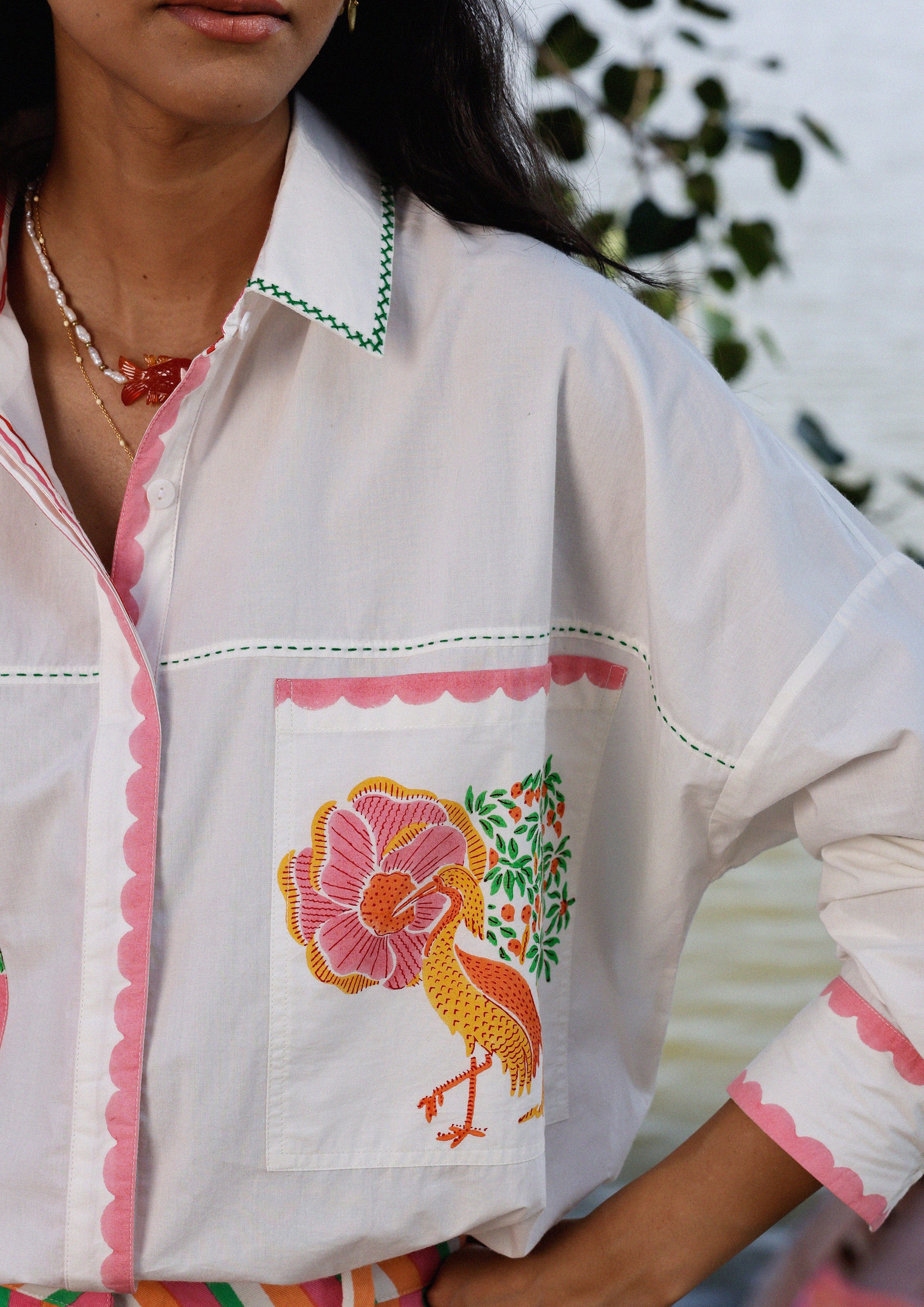 The Raw India Jaigarh Shirt River Crane in tops, featuring a vibrant river crane design on lightweight fabric.