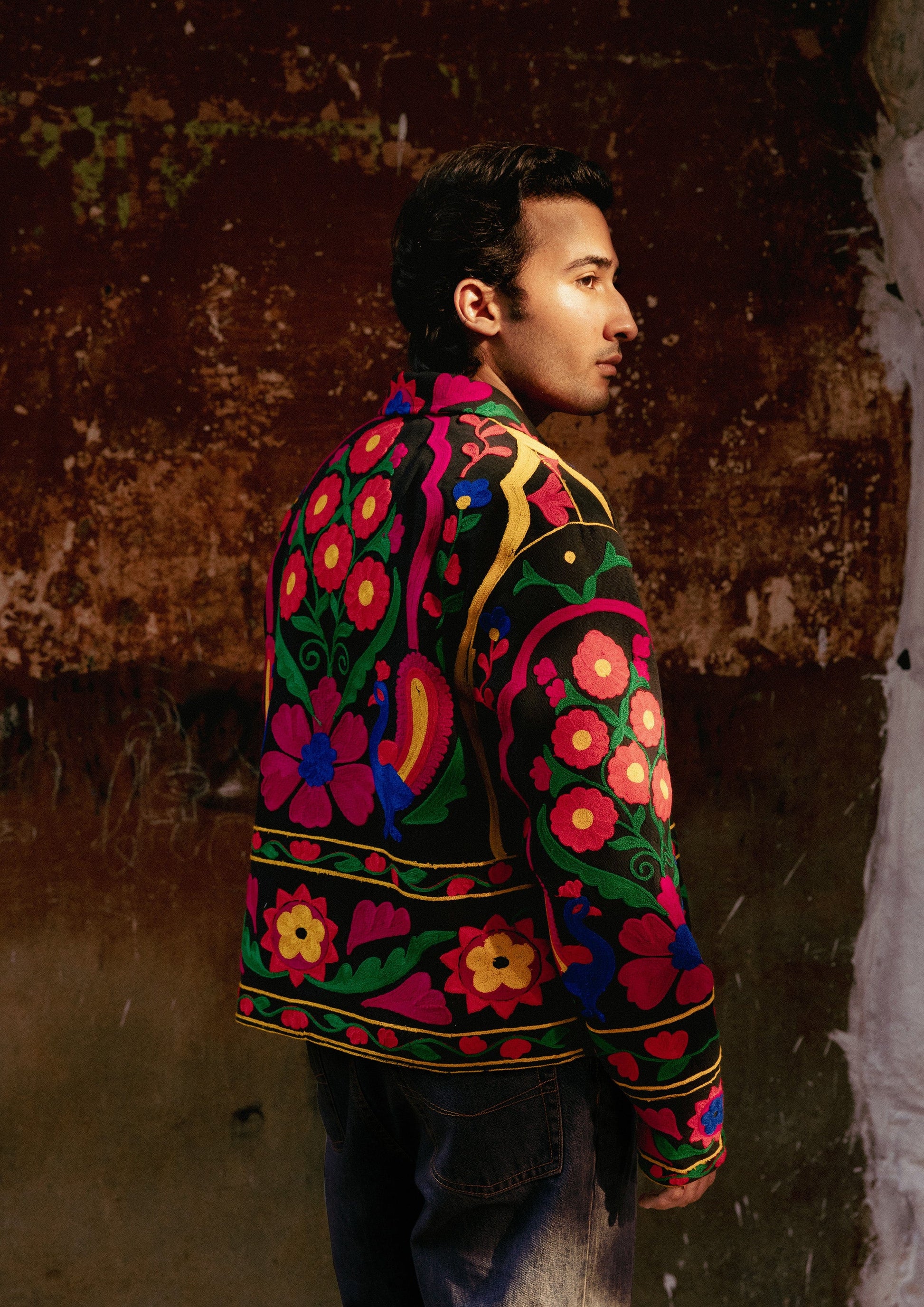 Jaipur jacket by The Raw India with intricate peacock embroidery, showcasing vibrant colors and detailed traditional design.