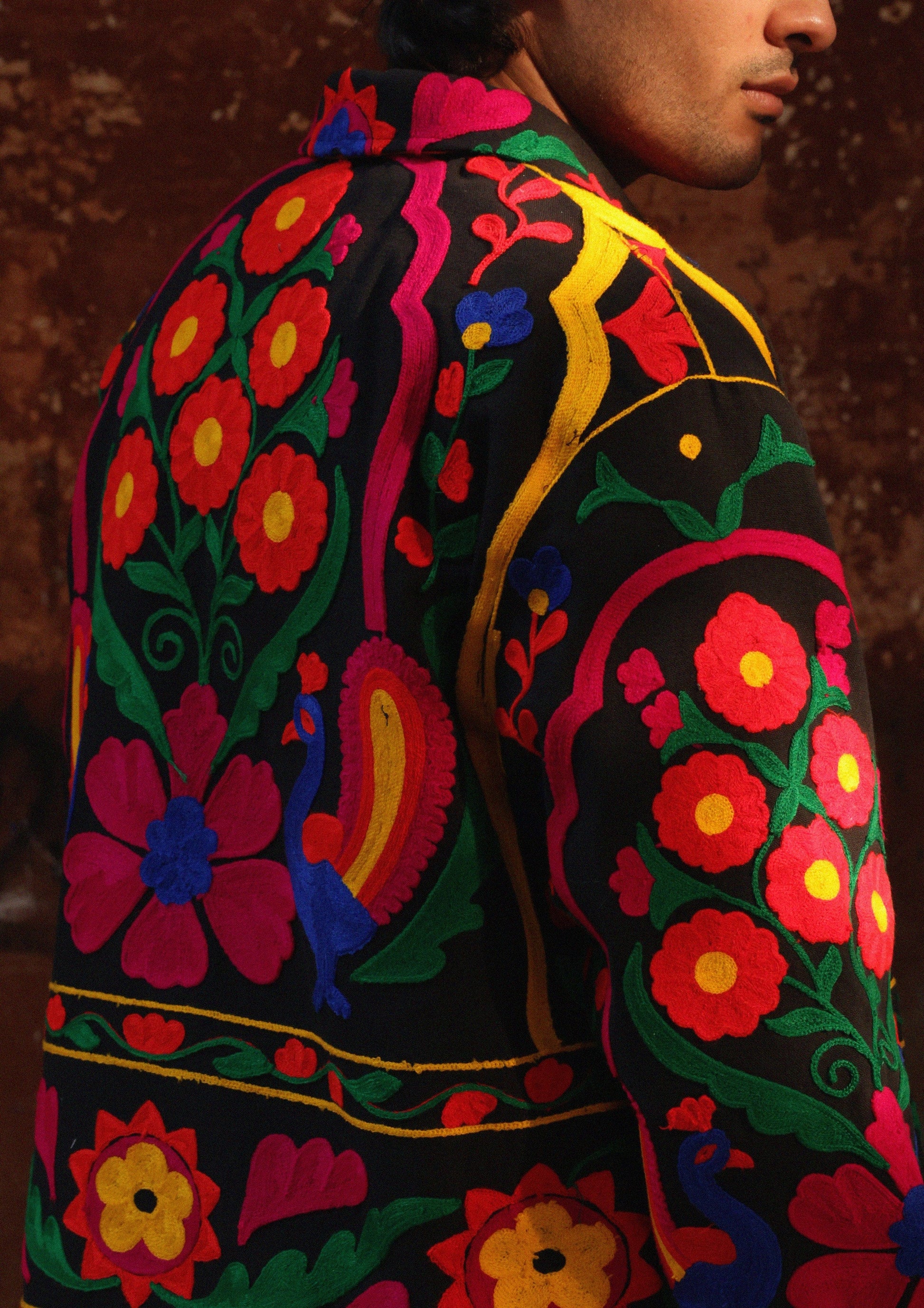 Colorful Jaipur jacket by The Raw India featuring intricate peacock embroidery and traditional design details.
