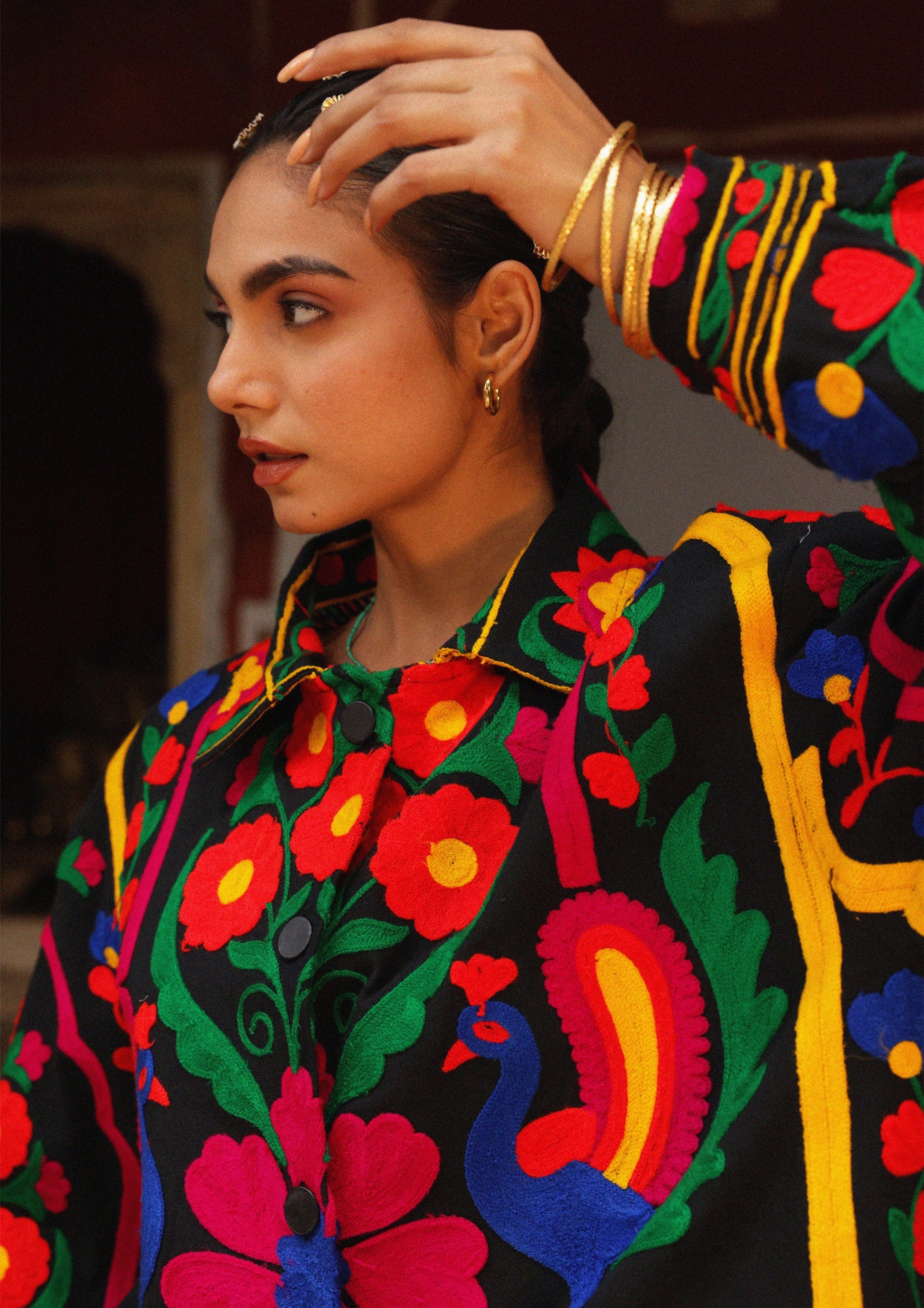 Pink Jaipur jacket by The Raw India with intricate peacock embroidery, showcasing traditional Indian craftsmanship.