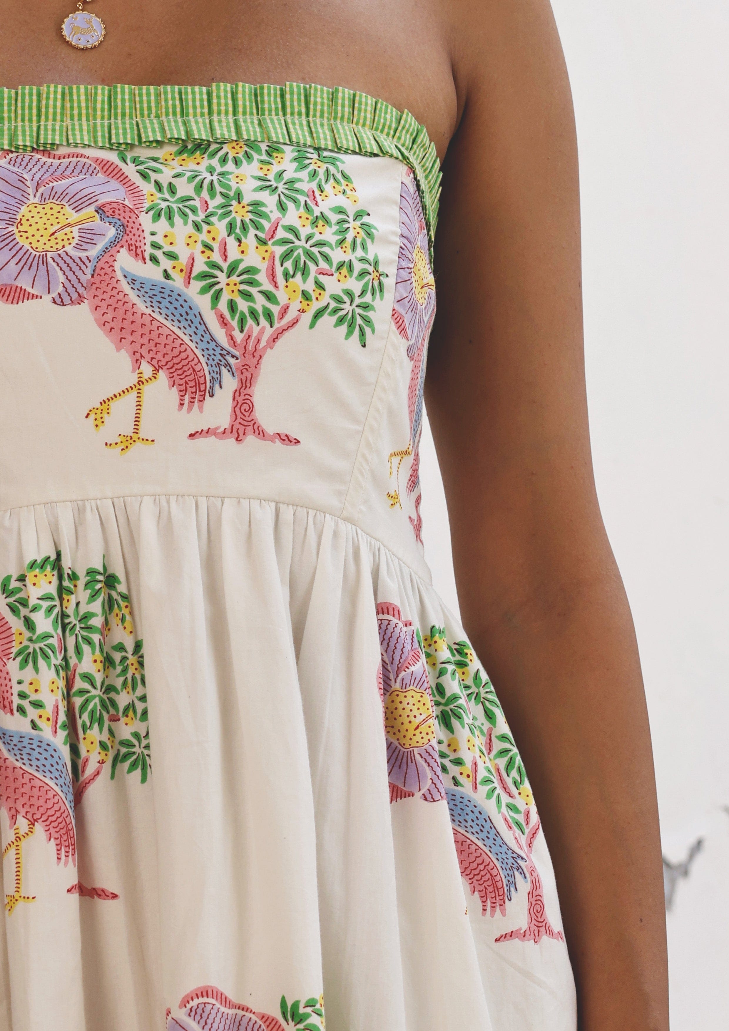 Elegant Jobner Dress Saras Crane by The Raw India featuring intricate patterns and vibrant colors, perfect for festive occasions.