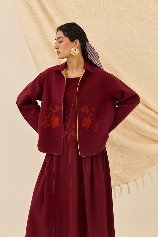 Kuhu handloom reversible jacket by JODI, showcasing vibrant patterns and traditional craftsmanship, worn open to display both sides.