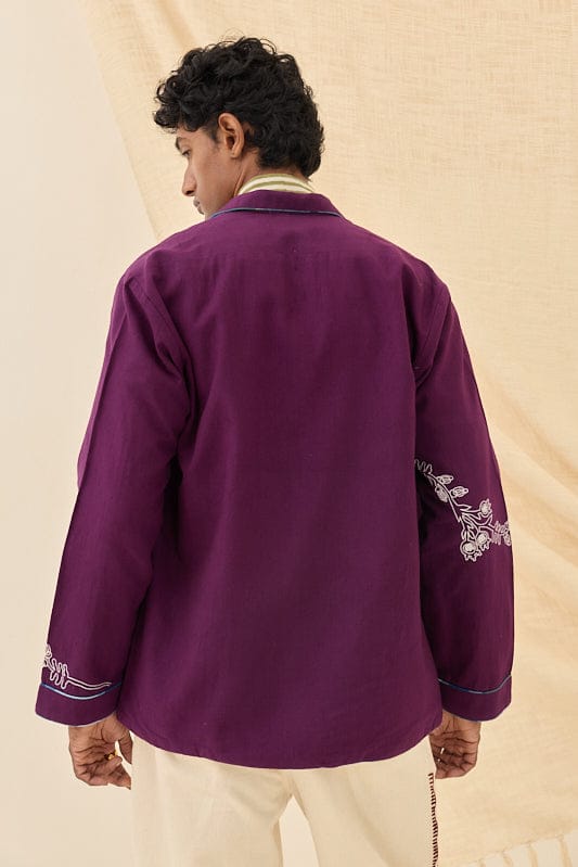 Reversible Morni handloom jacket by JODI featuring traditional woven patterns and vibrant colors, displayed on a hanger.