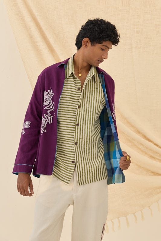 Reversible Morni handloom jacket by JODI, showcasing vibrant patterns and traditional craftsmanship, worn as a stylish outerwear piece.