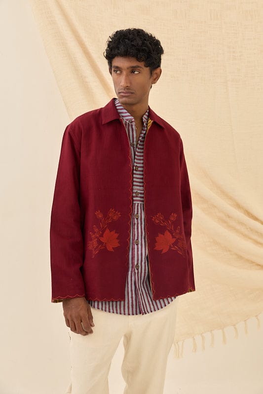 Reversible Kuhu handloom jacket by JODI showing intricate woven patterns in earthy tones and vibrant colors.