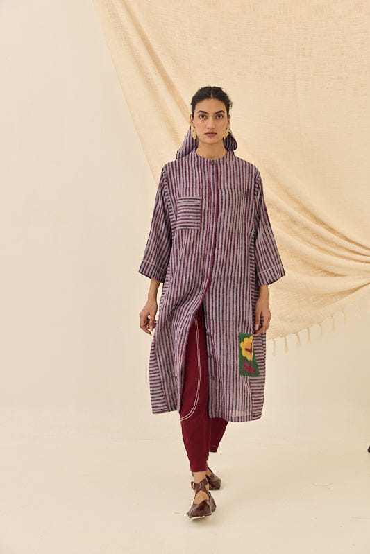 JODI Koyal kurta dress with intricate embroidery and vibrant colors, displayed on a hanger.