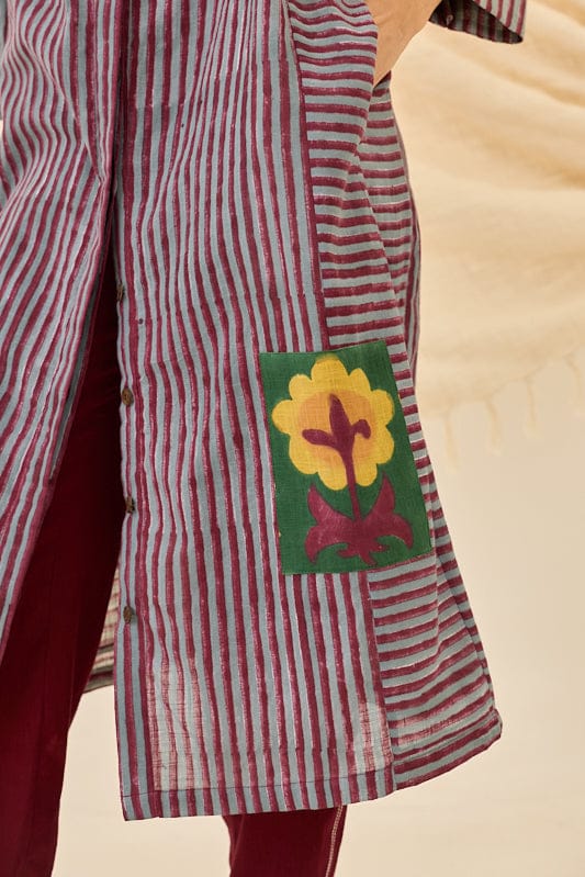 JODI Koyal kurta dress with intricate embroidery, featuring a vibrant, traditional design displayed on a hanger.