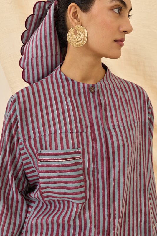 JODI Koyal kurta dress in vibrant fabric with intricate patterns, displayed on a hanger against a neutral background.