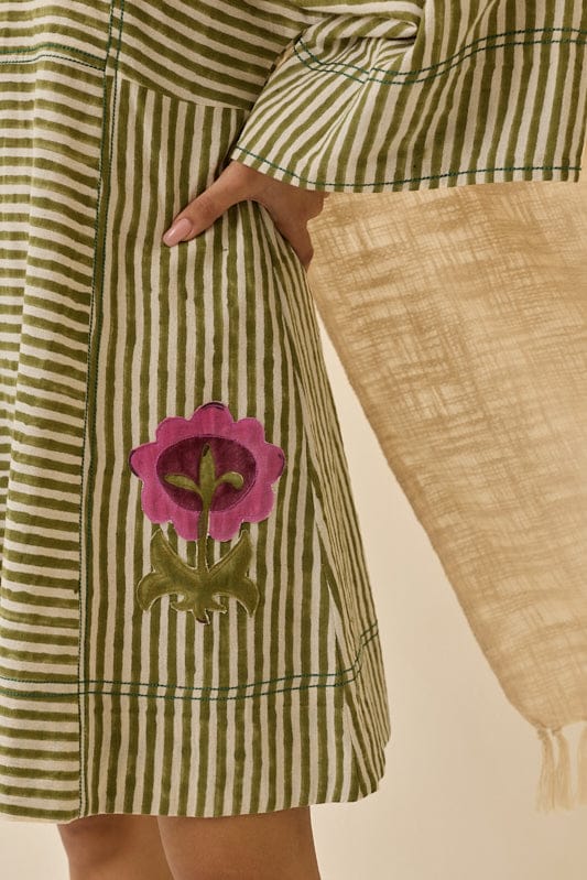JODI Pihu handloom shift dress in vibrant fabric with a relaxed fit and traditional design, displayed on a hanger.