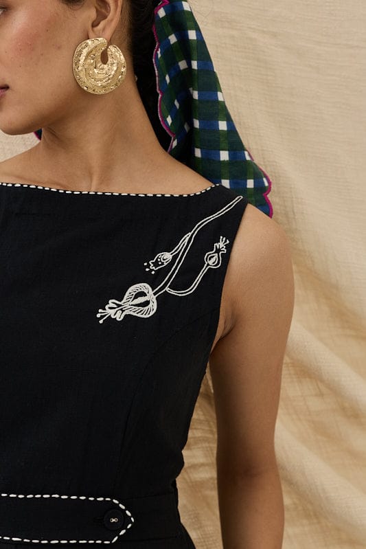 JODI Jugnu handloom dress with vibrant woven fabric, featuring traditional patterns and a relaxed fit, displayed on a hanger.