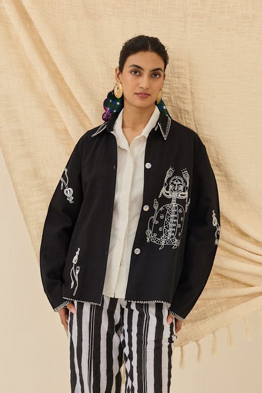 JODI Jugnu handloom jacket with intricate woven patterns, long sleeves, and a tailored fit, displayed on a hanger.