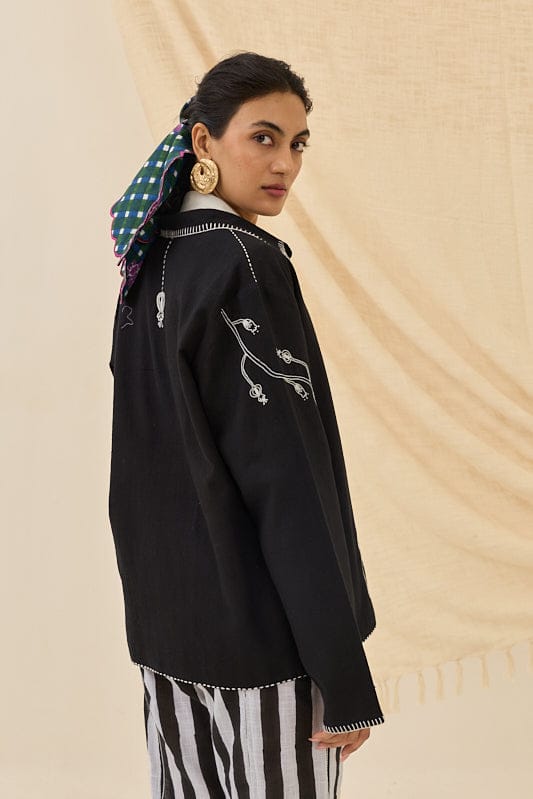 JODI Jugnu handloom jacket with intricate embroidery, featuring a traditional design and vibrant colors, displayed on a hanger.