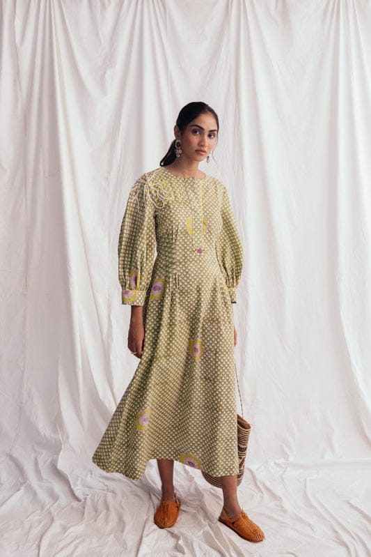 JODI Panna dress displayed on a model, featuring a flowy design with intricate detailing, perfect for stylish occasions.