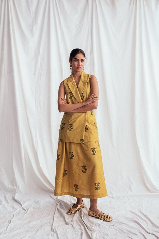 JODI Nimbu silk blazer jacket in vibrant yellow with tailored fit, featuring lapels and button closure, styled on model.
