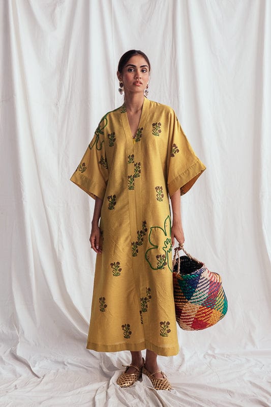 JODI Nimbu silk day dress featuring a flowy silhouette and vibrant yellow color, perfect for casual or semi-formal occasions.