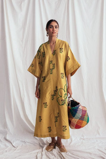 JODI Nimbu silk day dress featuring a flowy silhouette and vibrant yellow color, perfect for casual or semi-formal occasions.