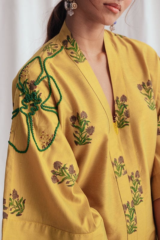 JODI Nimbu silk day dress featuring a flowy silhouette and vibrant yellow color, perfect for casual or semi-formal occasions.