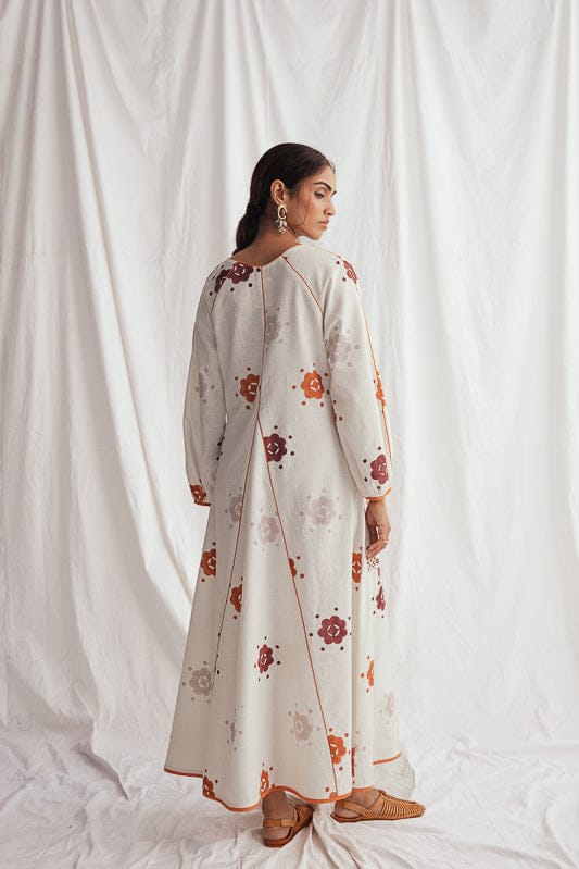 JODI Thandai peasant dress featuring colorful floral patterns and relaxed fit, ideal for casual or bohemian style.