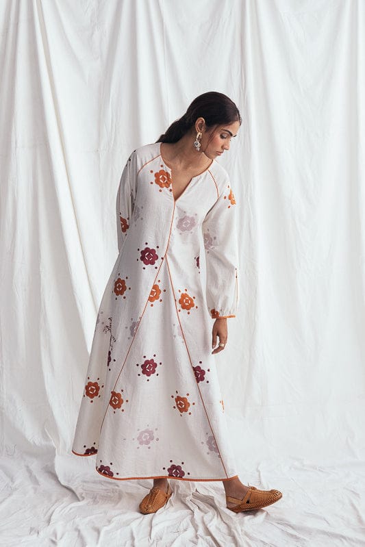JODI Thandai peasant dress with vibrant traditional patterns and flowing fabric, stylish and comfortable for casual wear.