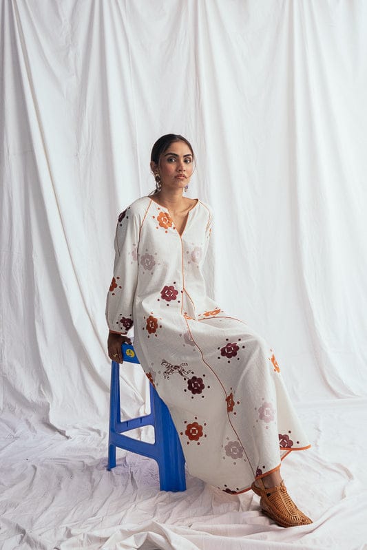 JODI Thandai peasant dress with intricate embroidery and flowing fabric, showcased in a stylish bohemian look.