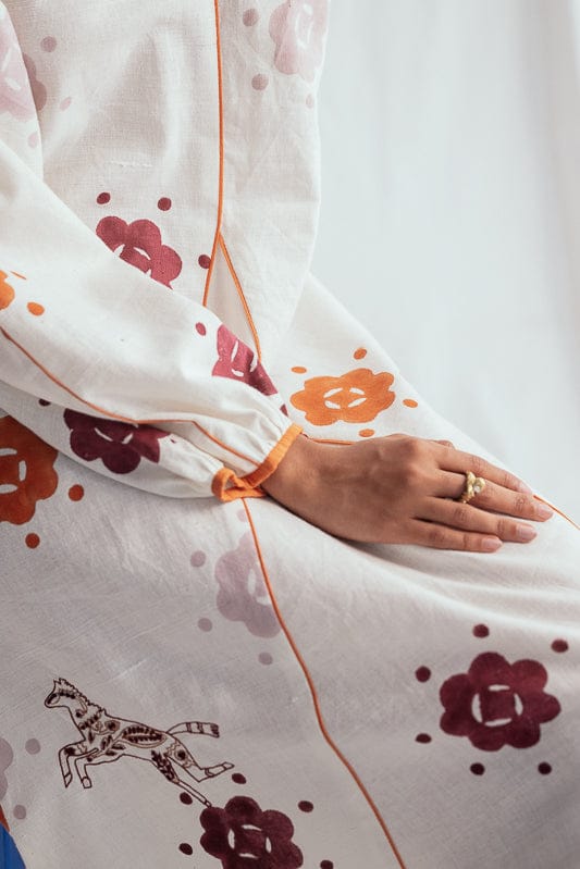 JODI Thandai peasant dress featuring vibrant traditional patterns and flowy fabric, perfect for casual or festive wear.