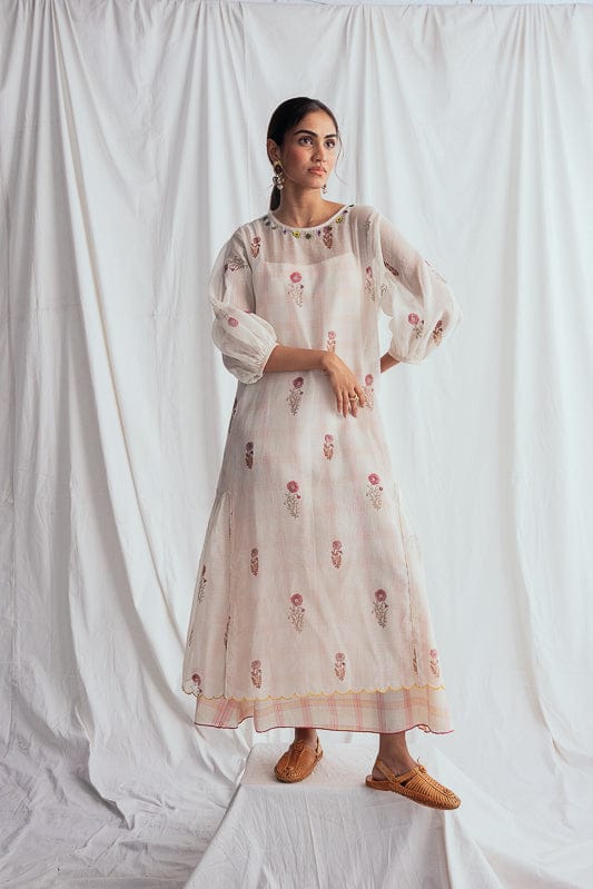 JODI Kulfi peasant dress with flowy fabric and intricate embroidery, styled with boho-inspired design and relaxed fit.